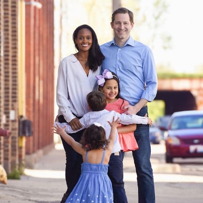 Nicole Fiscella along with her husband and her three children posing for a photo shoot.